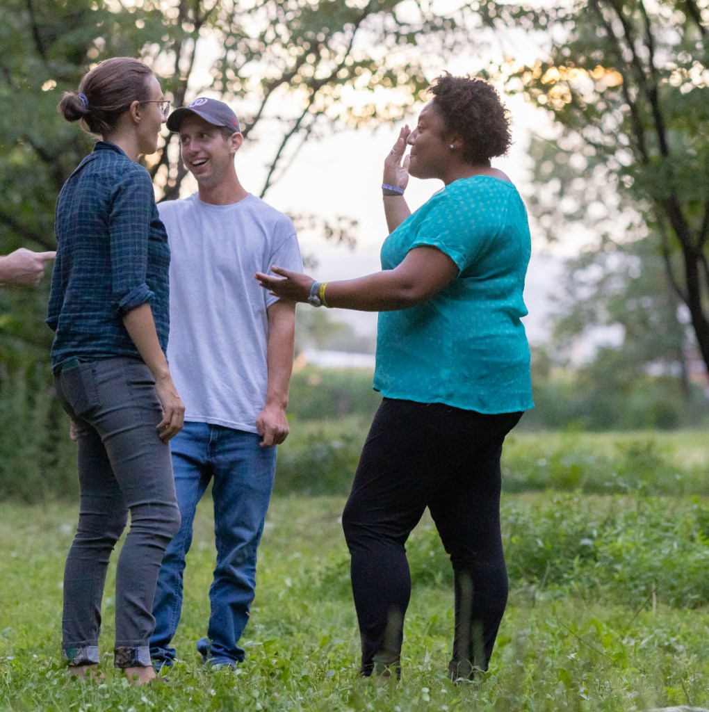 Board members Pam Mandigo and Liz Marin talk with an audience member